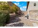 Brick pathway through a gravel backyard at 788 Flowing Meadow Dr, Henderson, NV 89014