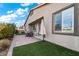 Private backyard with artificial turf, paver patio, and a view of the home at 788 Flowing Meadow Dr, Henderson, NV 89014