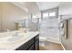 Clean bathroom with a shower/tub combo and modern vanity at 788 Flowing Meadow Dr, Henderson, NV 89014