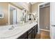 Double vanity bathroom with granite countertop and modern fixtures at 788 Flowing Meadow Dr, Henderson, NV 89014