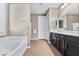 Elegant bathroom with double vanity and soaking tub at 788 Flowing Meadow Dr, Henderson, NV 89014