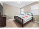 Bright bedroom with a comfortable bed and dresser at 788 Flowing Meadow Dr, Henderson, NV 89014