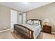 Spacious bedroom with a comfortable bed and nightstand at 788 Flowing Meadow Dr, Henderson, NV 89014