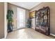 Bright entryway with wood-look floors and decorative cabinet at 788 Flowing Meadow Dr, Henderson, NV 89014