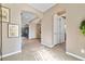 Spacious hallway with archways and wood-look floors at 788 Flowing Meadow Dr, Henderson, NV 89014