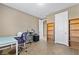 Bright home office with desk, chair, and built-in shelving at 788 Flowing Meadow Dr, Henderson, NV 89014