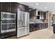 Modern kitchen with stainless steel appliances and granite countertops at 788 Flowing Meadow Dr, Henderson, NV 89014