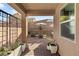 Relaxing backyard patio with pavers, seating area, and shade umbrella at 8113 Brown Clay Ave, Las Vegas, NV 89113