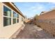 Large backyard patio with pavers and seating area next to house at 8113 Brown Clay Ave, Las Vegas, NV 89113