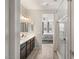 Double vanity bathroom with shower and bedroom view at 8113 Brown Clay Ave, Las Vegas, NV 89113