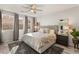 Main bedroom with plush carpet, a king-size bed, and ample natural light at 8113 Brown Clay Ave, Las Vegas, NV 89113