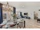 Elegant dining area with a chandelier and seating for six at 8113 Brown Clay Ave, Las Vegas, NV 89113