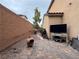 Outdoor patio space featuring neutral brick and BBQ, great for entertaining friends or relaxing! at 8396 Waylon Ave, Las Vegas, NV 89178