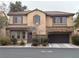 Charming two-story home featuring a well-maintained lawn and an attached two-car garage at 8396 Waylon Ave, Las Vegas, NV 89178