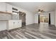 Finished basement features a kitchenette, sliding door to backyard and wood-look floors at 8428 Summers Ranch Ct, Las Vegas, NV 89139