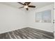 Spacious bedroom with ceiling fan and wood-look floors at 8428 Summers Ranch Ct, Las Vegas, NV 89139