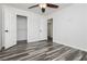 Bedroom with walk-in closet and wood-look floors at 8428 Summers Ranch Ct, Las Vegas, NV 89139