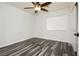 Bright bedroom with wood-look floors and ceiling fan at 8428 Summers Ranch Ct, Las Vegas, NV 89139