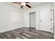 Bedroom with walk-in closet and wood-look floors at 8428 Summers Ranch Ct, Las Vegas, NV 89139