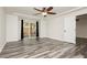 Bright bedroom with hardwood floors and sliding glass door to patio at 8428 Summers Ranch Ct, Las Vegas, NV 89139