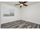 Bedroom with ceiling fan and wood-look floors at 8428 Summers Ranch Ct, Las Vegas, NV 89139