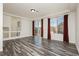 Living room with wood-look floors and sliding glass doors at 8428 Summers Ranch Ct, Las Vegas, NV 89139