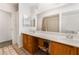 Double vanity bathroom with a large mirror and tiled floor at 845 Palo Verde Dr, Henderson, NV 89015