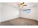 Bright bedroom featuring carpet, window, and ceiling fan at 845 Palo Verde Dr, Henderson, NV 89015