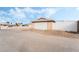 Detached garage with white door and gravel driveway at 845 Palo Verde Dr, Henderson, NV 89015