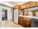 Kitchen with white refrigerator and wood cabinets at 845 Palo Verde Dr, Henderson, NV 89015