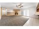 Spacious living room featuring a brick fireplace and patio doors at 845 Palo Verde Dr, Henderson, NV 89015