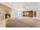 Living room with fireplace, wood flooring, and kitchen access at 845 Palo Verde Dr, Henderson, NV 89015