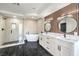 Modern bathroom with double vanity, soaking tub, and walk-in shower at 8509 Copper Falls Ave, Las Vegas, NV 89129