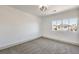 Bright bedroom with carpet flooring and window at 8509 Copper Falls Ave, Las Vegas, NV 89129