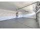 Spacious garage with ample storage and neutral epoxy flooring at 8509 Copper Falls Ave, Las Vegas, NV 89129