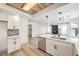 Modern kitchen with white cabinets, quartz countertops, and stainless steel appliances at 8509 Copper Falls Ave, Las Vegas, NV 89129