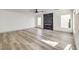 Living room with fireplace and light wood-look flooring at 8509 Copper Falls Ave, Las Vegas, NV 89129