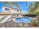 Stunning pool and backyard oasis with a two-story house at 8509 Copper Falls Ave, Las Vegas, NV 89129