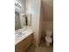 Small half bathroom with toilet and sink at 8800 Roping Rodeo Ave # 103, Las Vegas, NV 89178