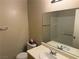 Main bathroom with a bathtub, sink, and mirror at 8800 Roping Rodeo Ave # 103, Las Vegas, NV 89178