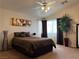 Spacious bedroom with large window and ceiling fan at 8800 Roping Rodeo Ave # 103, Las Vegas, NV 89178