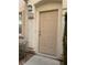 Beige front door with a simple design and address number 103 at 8800 Roping Rodeo Ave # 103, Las Vegas, NV 89178