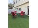 Private patio with seating for six and artificial turf at 8800 Roping Rodeo Ave # 103, Las Vegas, NV 89178