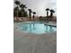 Community pool with palm trees and ample space at 8800 Roping Rodeo Ave # 103, Las Vegas, NV 89178