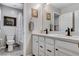 Well-lit bathroom featuring a double vanity with white cabinets and shower with bathtub at 889 Ariel Heights Ave, Las Vegas, NV 89138