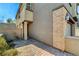 Paver driveway and stone accents highlight this property's exterior; front entrance and gated courtyard at 889 Ariel Heights Ave, Las Vegas, NV 89138