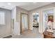 Upstairs hallway with a view to a bedroom and large decorative mirror at 889 Ariel Heights Ave, Las Vegas, NV 89138