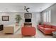 Inviting living room featuring neutral-toned walls, shuttered windows, and comfortable seating arrangements at 889 Ariel Heights Ave, Las Vegas, NV 89138