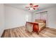 Bright bedroom with hardwood floors and a ceiling fan at 9008 Rusty Rifle Ave, Las Vegas, NV 89143