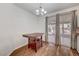 Dining area with dark wood table and access to the backyard at 9008 Rusty Rifle Ave, Las Vegas, NV 89143